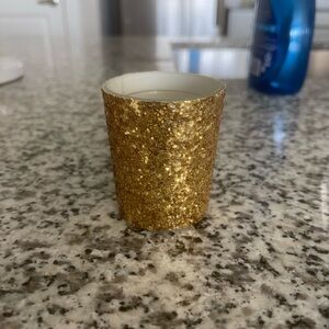 48 gold candles and holders